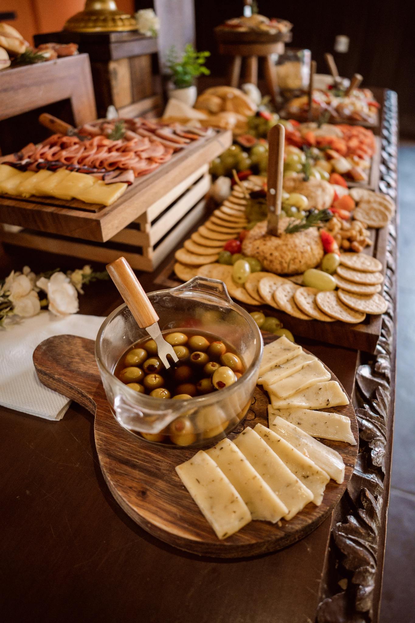 A beautifully arranged cheese and charcuterie table perfect for weddings.